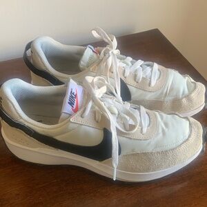 Nike women’s Cream and Black Sneakers